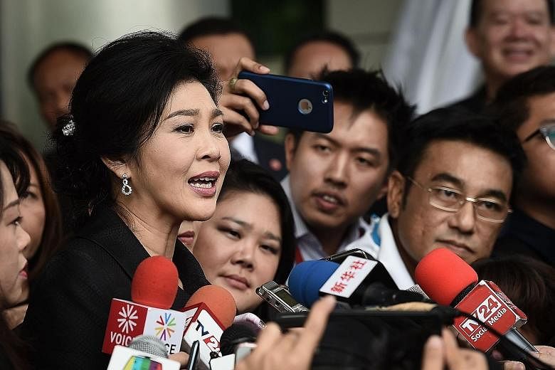 Former Thai prime minister Yingluck Shinawatra speaking to the media after leaving the Supreme Court in Bangkok last month. The kingdom's first female prime minister could be jailed for up to 10 years if found guilty of criminal negligence for failin