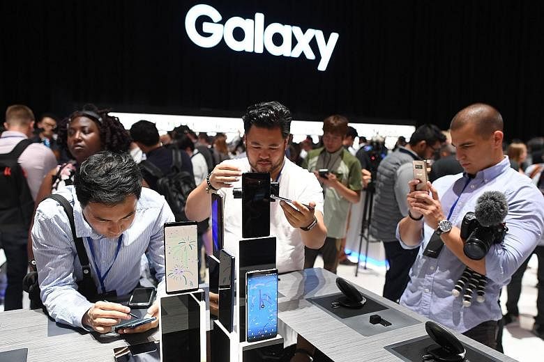 Members of the media at a preview of the Samsung Galaxy Note8 on Wednesday. The phone has dual rear cameras, added features for its S Pen Stylus and a large 6.3-inch display.