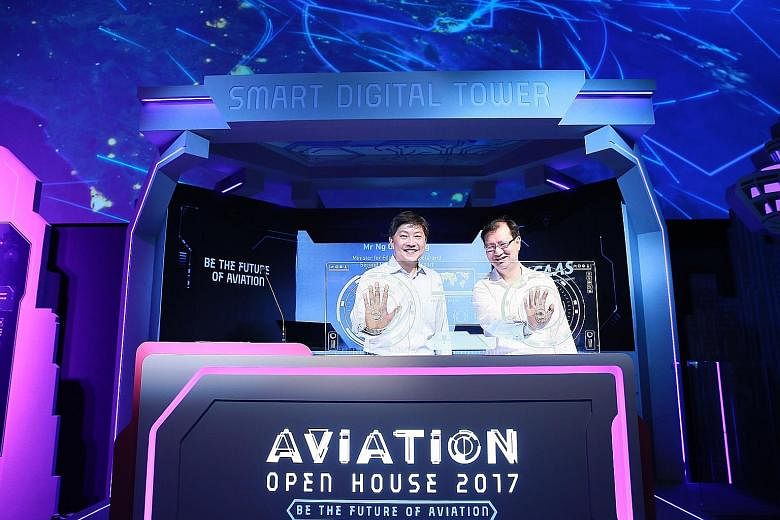 Minister for Education (Schools) and Second Minister for Transport Ng Chee Meng (left) and Mr Kevin Shum, director-general of the Civil Aviation Authority of Singapore, launching the Aviation Open House, which showcases career and education opportuni