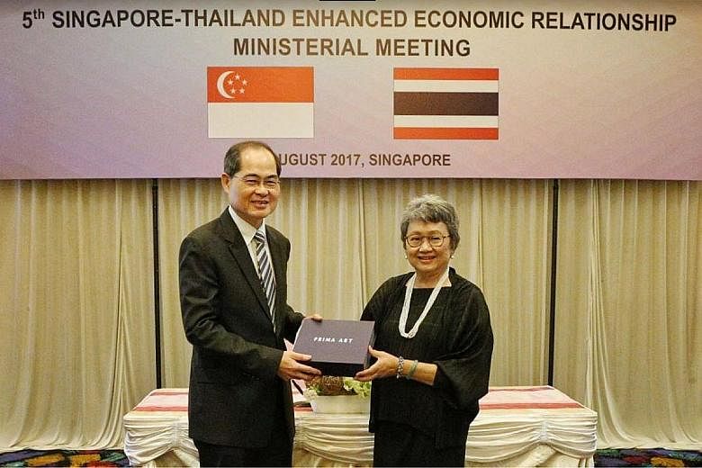 Above: Singapore's Minister for Trade and Industry (Trade), Mr Lim Hng Kiang, with Thailand's Minister of Commerce, Mrs Apiradi Tantraporn, at the 5th Singapore-Thailand Enhanced Economic Relationship (Steer) Ministerial Meeting held in Singapore yes