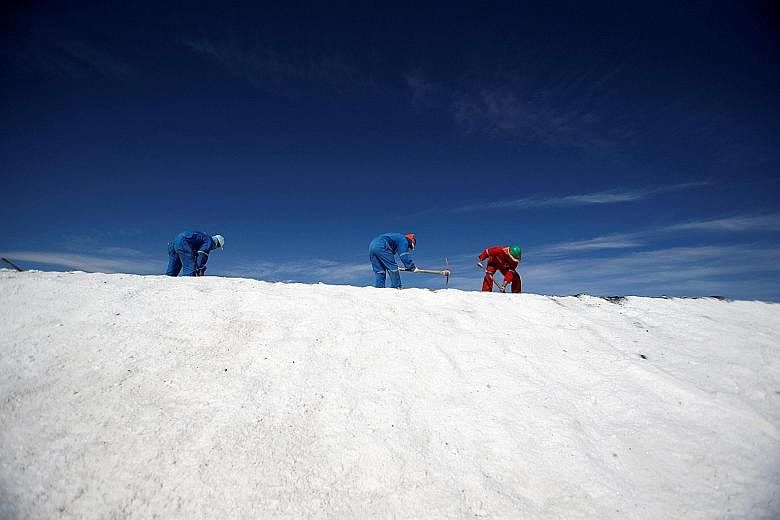 Labourers working at a lithium mine on a salt flat in the Atacama desert of northern Chile.