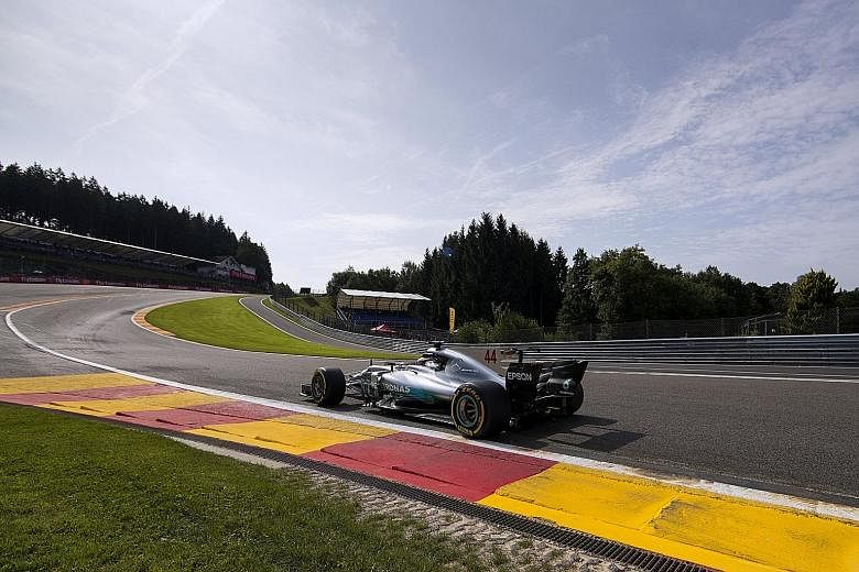 Lewis Hamilton of Mercedes in action during practice at the Spa-Francorchamps circuit yesterday. He is trailing Ferrari's Sebastian Vettel by 14 points heading into tomorrow's Belgian Grand Prix.