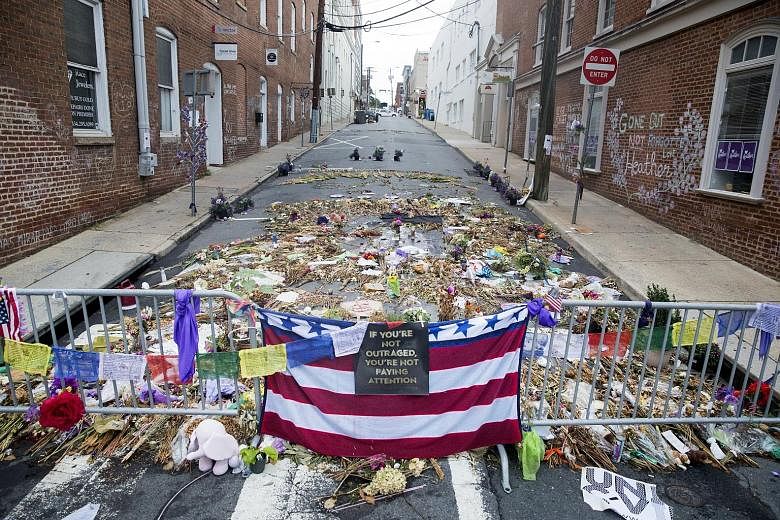 Tributes placed in memory of Ms Heather Heyer at the site in the US city of Charlottesville where a car rammed into a crowd, killing her. Citing the episode, Mr K. Shanmugam said societies cannot just look to "debate and discussion" to build and main