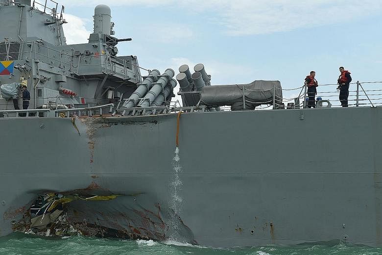The damaged USS John S. McCain on Monday. US Pacific Air Forces chief Terrence J. O'Shaughnessy said yesterday that the US will continue to "sail and fly anywhere where international rules allow".