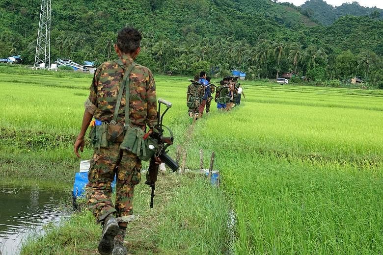 Myanmar soldiers in ChainKharLi Rakhine ethnic village, an area close to the fighting at Rathedaung township of Rakhine state in Myanmar on Friday. The death toll from attacks by Rohingya insurgents that day has climbed to 96, the government said. In