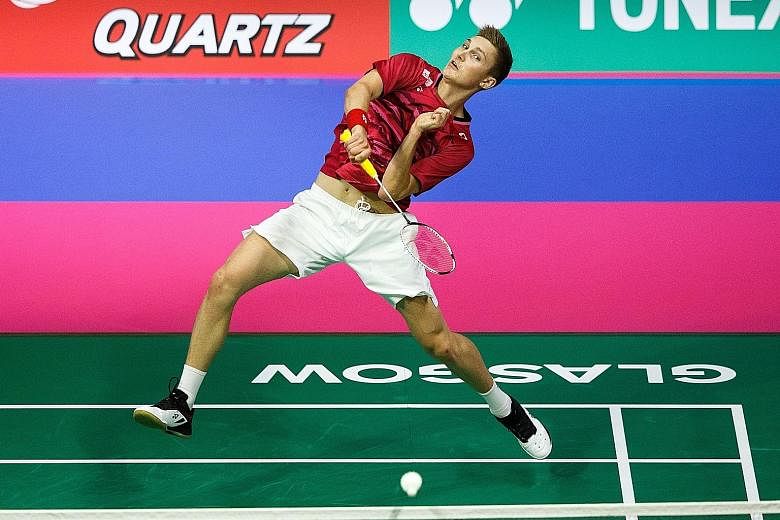 Denmark's Viktor Axelsen hits a return to China's Chen Long in the World Championships semi-final. The Dane won 21-9, 21-10 to reach the final for his first time.