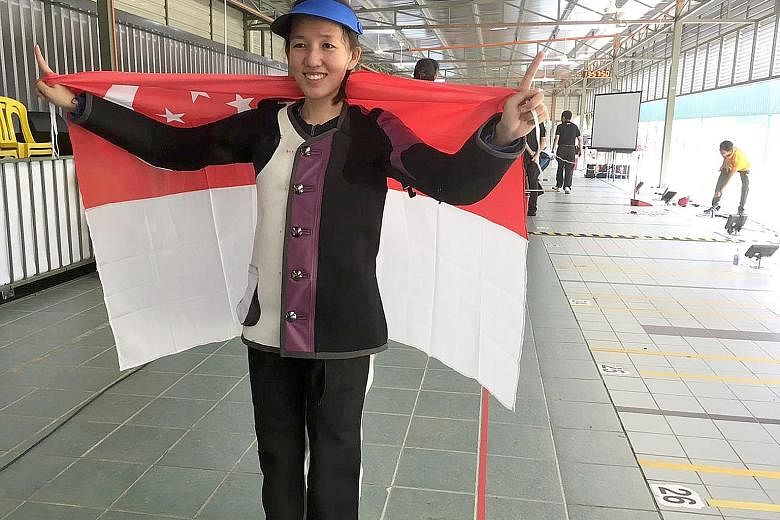 Shooter Jasmine Ser is overjoyed after coming from behind, following the kneeling and prone positions, to finish with 451.2 points to win the gold.