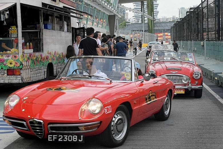 Some of the more than 100 vintage and supercars taking part in the first Racing Hearts charity drive yesterday. The passengers included more than 100 Community Chest beneficiaries.
