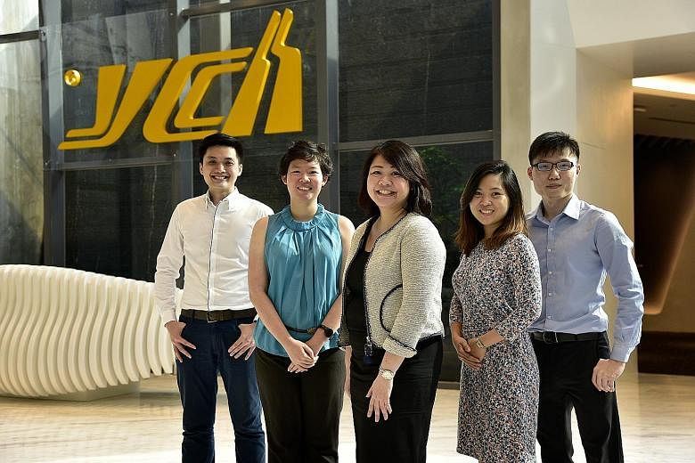 YCH Group head honcho Robert Yap, who took over in 1980, was instrumental in using technology to not only further the firm's regional expansion, but also to keep its employees ahead of the game. Staff from YCH include (from far left) Mr Ngoh Jun Dat,