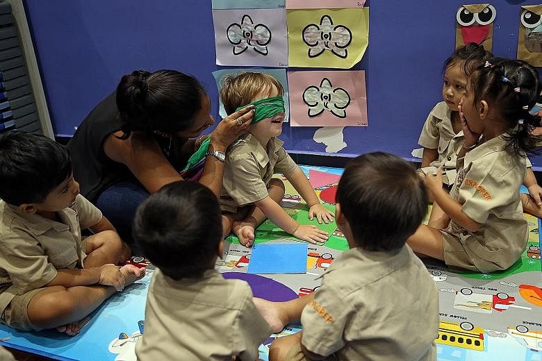A playgroup comprising Nursery 1 children in progress at Little Explorers' Cove childcare centre in Jurong West. The centre is said to have a higher proportion of minorities because of its mother tongue niche. Mr Viknesh Subramaniam runs two Little E