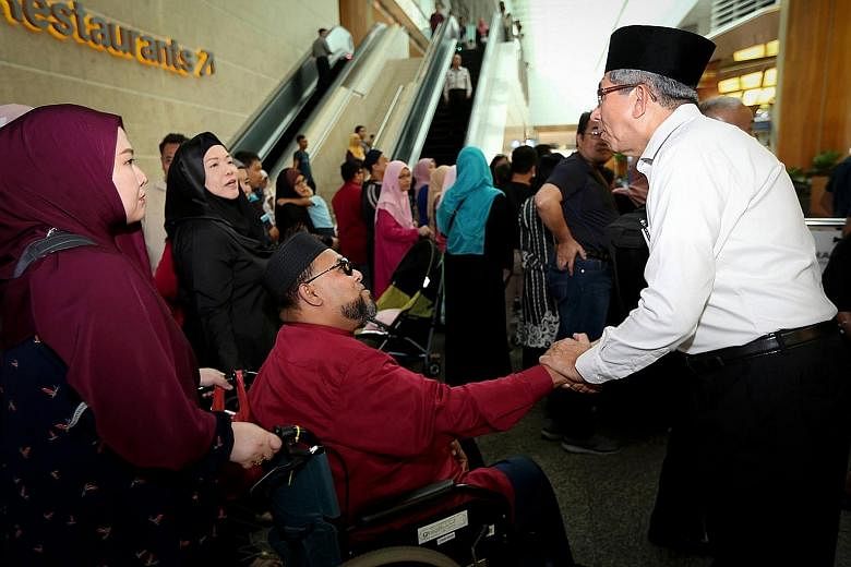 Minister-in-charge of Muslim Affairs Dr Yaacob Ibrahim seeing off some of the Singapore haj pilgrims on Thursday.