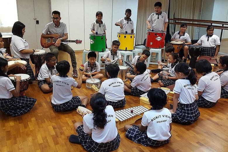 Mr Muhammad Dzuhri Juniwan exposes his pupils at Bukit View Primary School to a variety of musical instruments and incorporates different genres of music into his lessons.