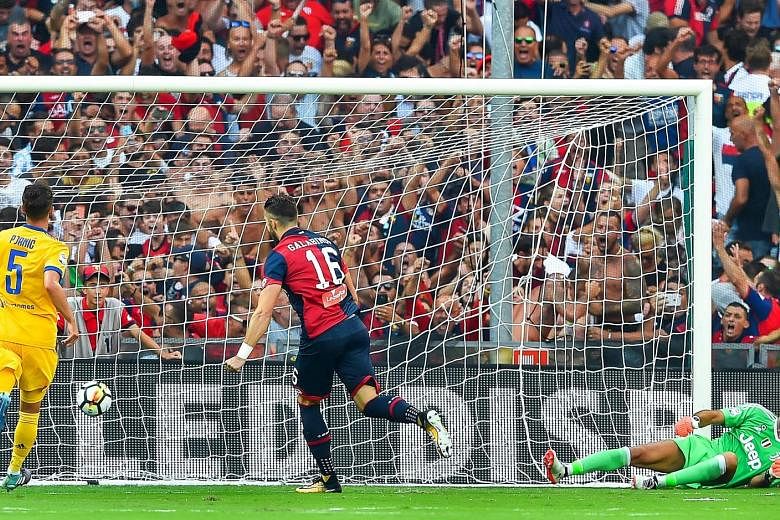 Forward Andrey Galabinov sends Gianluigi Buffon the wrong way with his seventh-minute penalty. He put Genoa 2-0 up against Juventus on Saturday but the Italian champions came back to win 4-2.