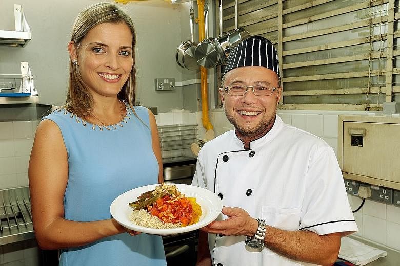 Px Plate's head dietitian, Ms Claudia Correia, and chef, Mr Thomas Chew, with one of the healthy meals prepared. The company's app will launch in the middle of next month.