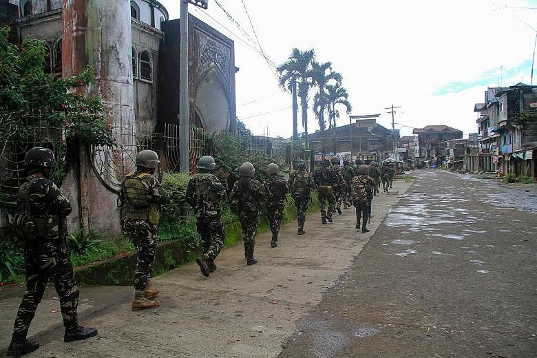 Philippine troops marching towards the front line of the battle against militants in Marawi early last month.