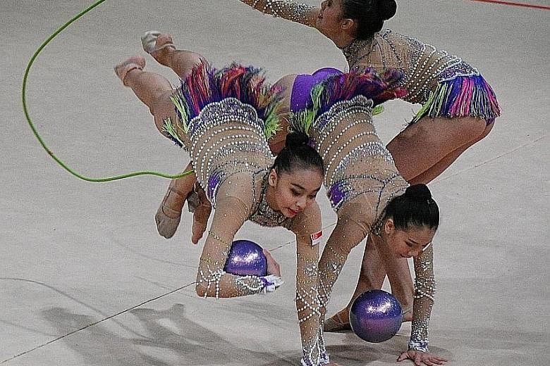 Singapore's rhythmic gymnastics team competing in the mixed apparatus final. They earned a creditable bronze despite four of the five team members participating in their first SEA Games.