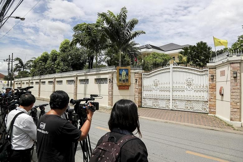 The media waiting outside Yingluck Shinawatra's home in Bangkok last Friday. She is now said to be in Dubai.