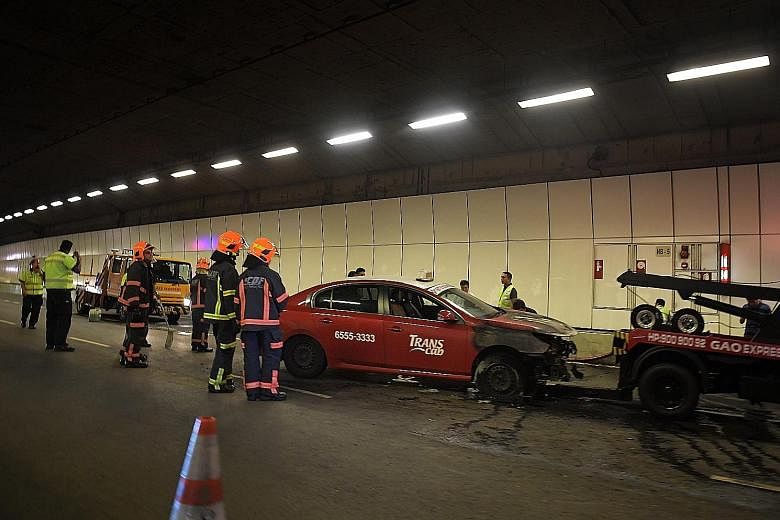 A TransCab taxi caught fire in the tunnel at about 7.10pm. The fire involving the engine compartment of the taxi was put out by two members of the public, but it was enough to fill the tunnel with smoke.