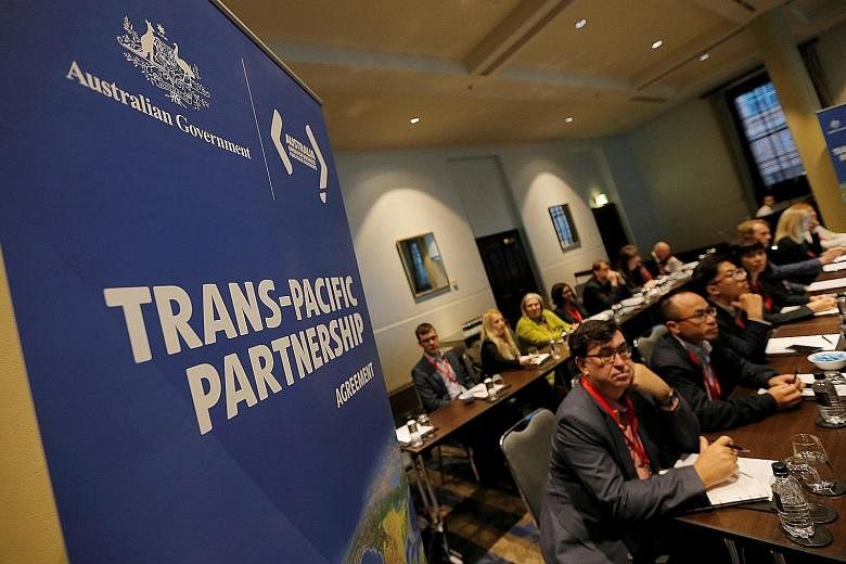 Delegates at the opening session of the Trans-Pacific Partnership senior leaders' meeting in Sydney on Monday. After the US' withdrawal, the remaining 11 TPP members, including Singapore, have publicly said they remain committed to the deal, and agre