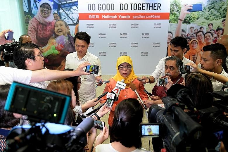 Madam Halimah Yacob speaking to the media yesterday during her press conference, where she announced her campaign slogan, "Do Good Do Together".