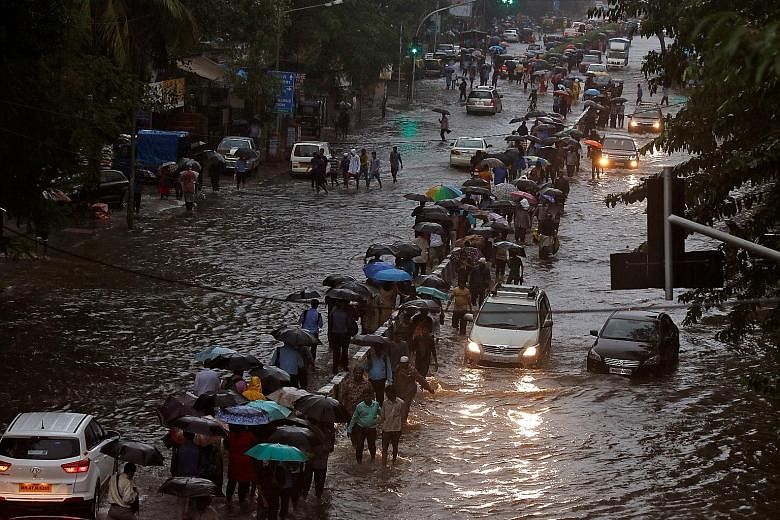 Many streets in Mumbai were inundated after the city received 29.8cm of rainfall over nine hours on Tuesday, in the worst rainfall in the region since 2005.