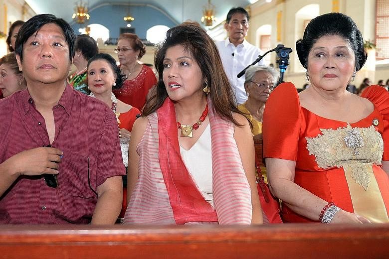 Senator Ferdinand Marcos Jr with his sister, Governor Imee Marcos, and mother Imelda attending mass during the birthday celebration of the former first lady at a church in Laoag City, northern Philippines, in this photo taken on July 2, 2014.