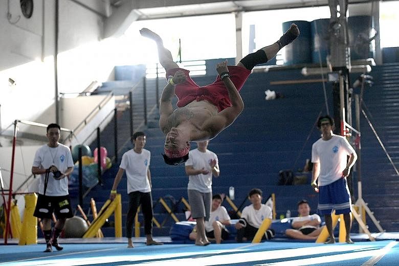 Mr Alex Li, 25, showing off his tricking skills during a battle at the Singapore Tricking Gathering at the GymKraft gymnasium in Mountbatten yesterday.