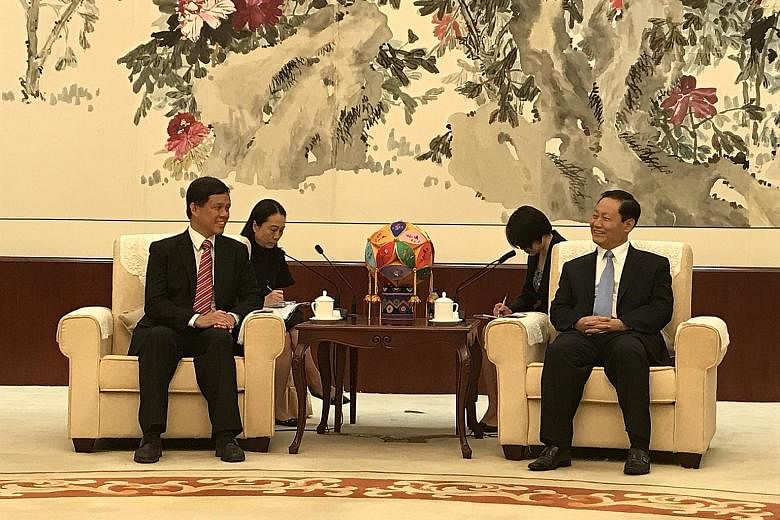 Minister in the Prime Minister's Office Chan Chun Sing with Guangxi party boss Peng Qinghua in Nanning yesterday. Mr Peng expressed strong support for the Southern Transport Corridor, said Mr Chan.