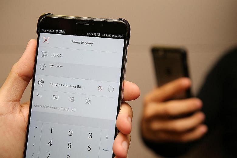 Singtel's Yuen Kuan Moon feels that having too many options, both online and offline, has made it harder for users to adopt mobile payments. UOB MyKey, the bank's new mobile keyboard for PayNow transactions, has been a hit with customers, says Ms Jac