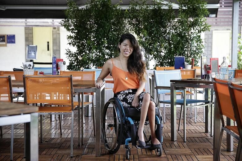 Swimmer Yip Pin Xiu, seen here at Cafe Melba, travels independently, taking taxis or Uber or Grab. She notes that attitudes towards the disabled here have improved in the last few years.