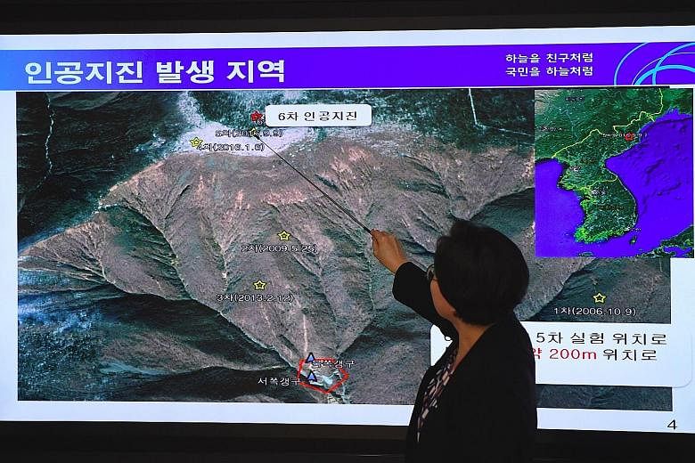 An official from the National Earthquake and Volcano Centre in Seoul yesterday showing the location of an earthquake in North Korea, believed to be where the North conducted its latest nuclear test.