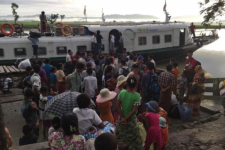 Rohingya refugees leaving Buthidaung jetty in Myanmar. Aid agencies estimate that 73,000 Rohingya have fled to Bangladesh since violence erupted last week.