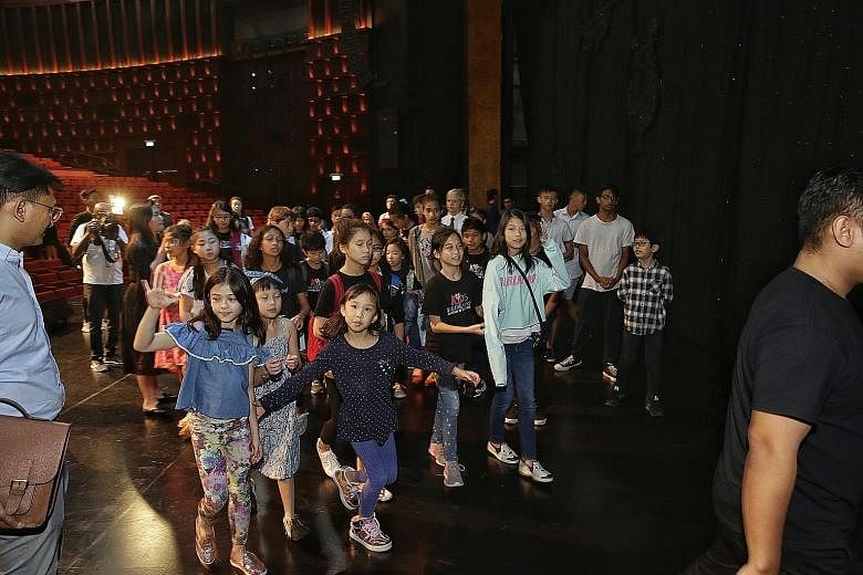 It is the first time Dick Lee is taking on the role of the concert's creative director. Here he is introducing some of the ChildAid performers to fellow performers. The cast and crew got together for the first time for a tour of the Resorts World The