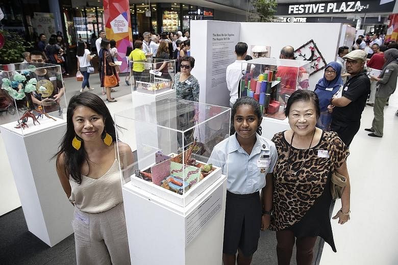 (From left in picture) Artist Mary Bernadette Lee guided Serangoon Secondary School student Susanna Bombay and retired teacher Daisy Leong in creating "Our Personalities Outshine", an artwork representing what home means to them, currently on display