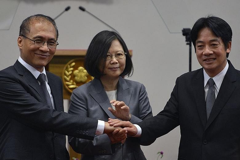 Taiwan President Tsai Ing-wen with outgoing Premier Lin Chuan and newly-appointed Premier William Lai Ching-te (far right) at the Presidential Palace in Taipei yesterday. Mr Lai has been touted as a potential successor to Ms Tsai.