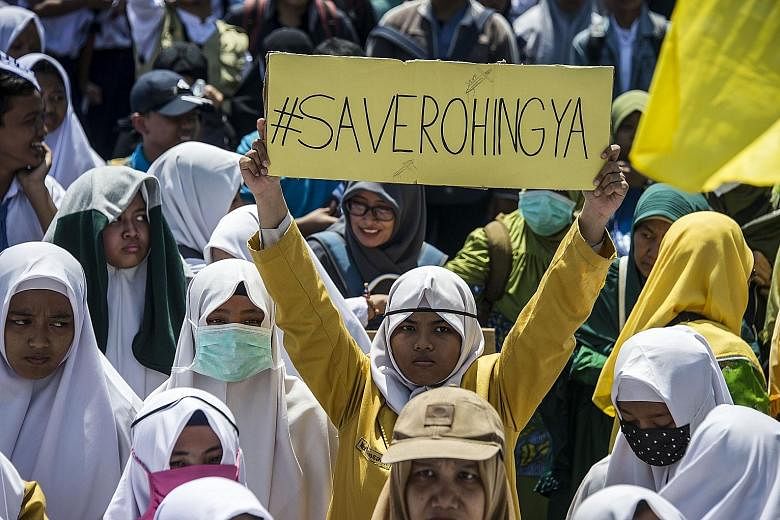 Indonesian activists at an anti-Myanmar protest in Surabaya yesterday. Similar protests have taken place in Jakarta and Malaysia's Kuala Lumpur.