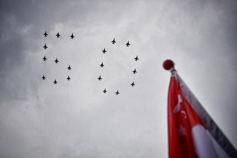 Despite a short downpour yesterday, 10 F-16 aircraft each from the Republic of Singapore Air Force and Indonesian Air Force flew past Marina South in the numeral "50" formation. It was the final rehearsal for the Singapore-Indonesia combined fly-past