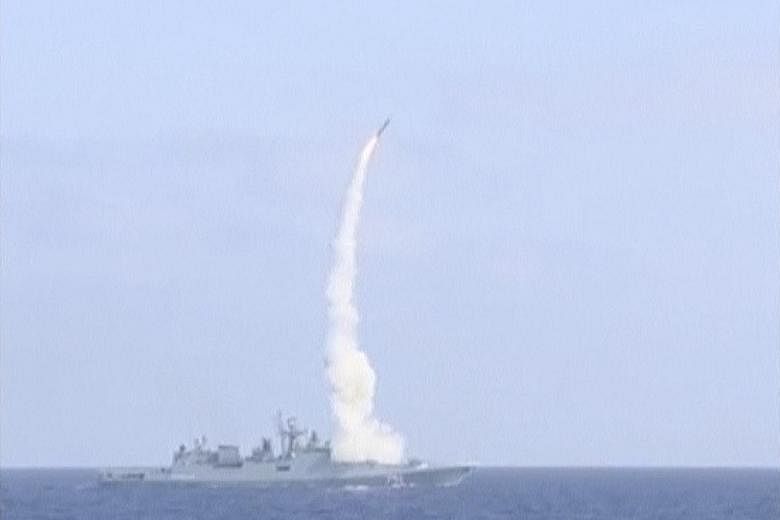 An image taken from video footage and released by Russia's Defence Ministry yesterday shows the Russian frigate Admiral Essen in the Mediterranean Sea firing a Kalibr cruise missile at ISIS targets near the Syrian city of Deir Ezzor.