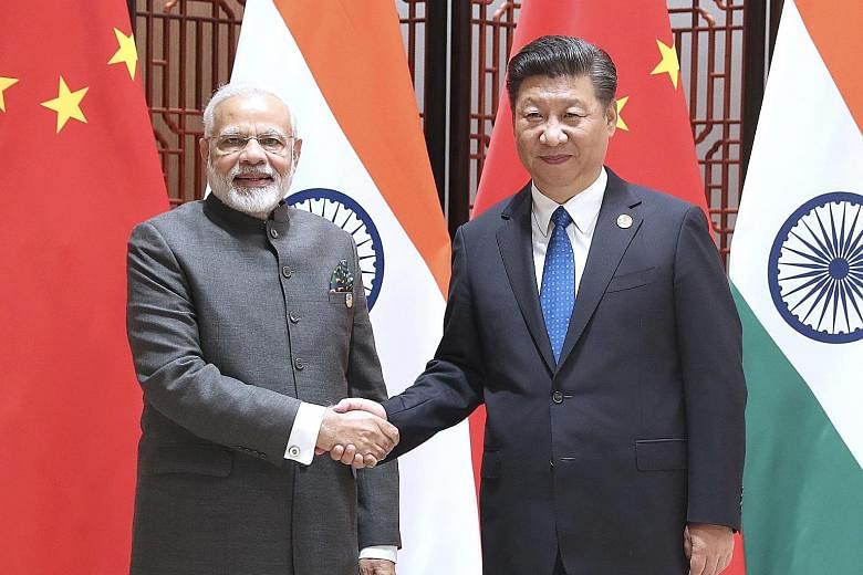 China's President Xi Jinping and India's Prime Minister Narendra Modi held talks at the 9th Brics summit in Xiamen yesterday.