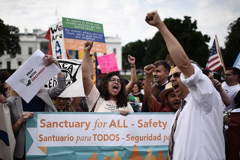 Immigrants and supporters demonstrating in front of the White House on Tuesday, at a rally in support of the Deferred Action for Childhood Arrivals (Daca). Congress has been given six months to reform the US' immigration laws - leaving some hope for 