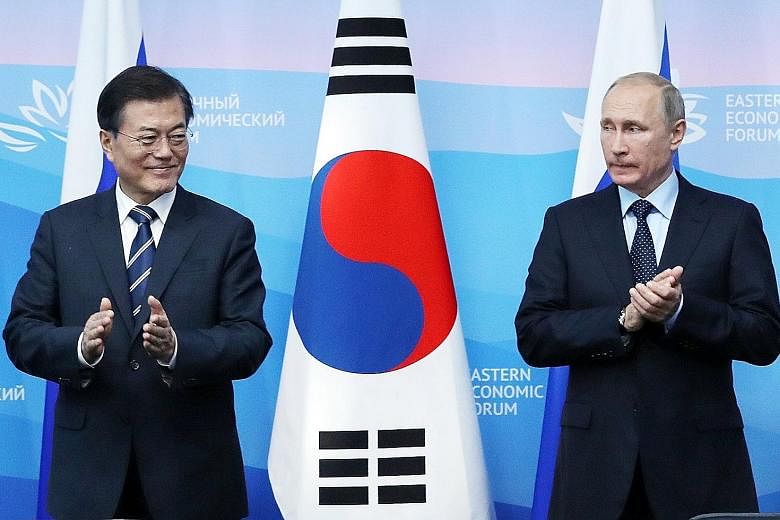 South Korean President Moon Jae In and his Russian counterpart Vladimir Putin in Vladivostok yesterday.