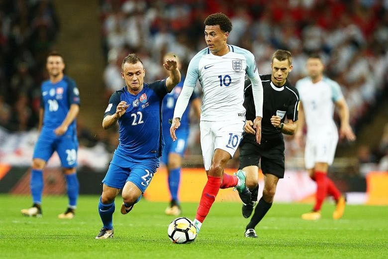 England's Dele Alli in action during the 2-1 win in their World Cup qualifier against Slovakia on Monday. The Football Association believes it can prove that Alli's one-finger salute was not directed at the referee.