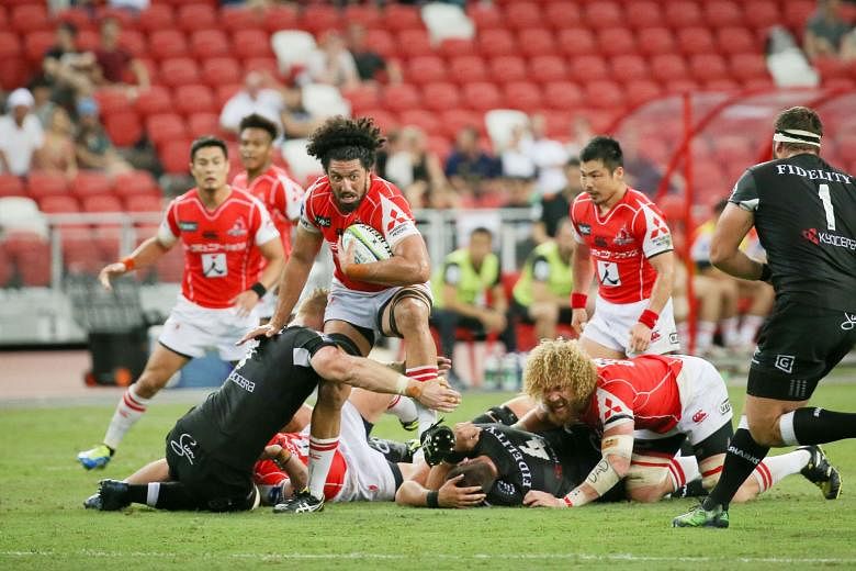 Sunwolves' Sam Wykes attempting to wriggle free from a Sharks defender during a Super Rugby game at the National Stadium in May. The physicality of teams in the South African Group last season was something the Asian side - co-based in Tokyo and Sing