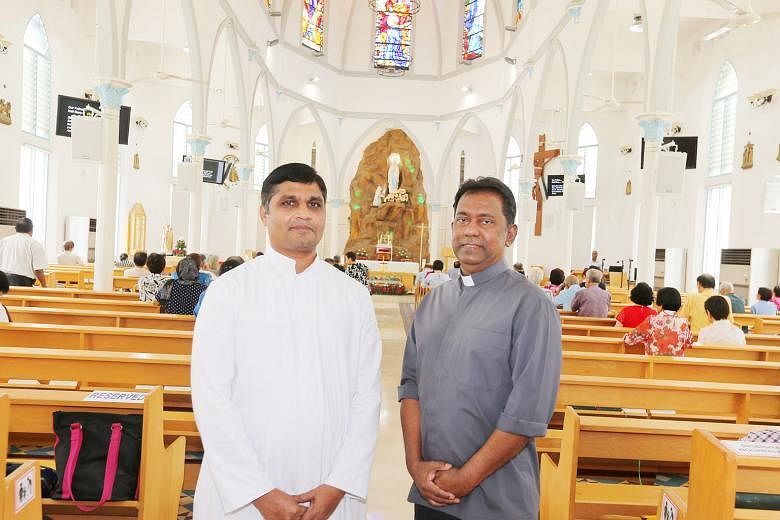 Father Michael Sitaram (in grey), the church's parish priest, with Father Nithiya SagayaRaj, the assistant parish priest, at the Church of Our Lady of Lourdes. The Church of Our Lady of Lourdes' neo-Gothic design was heavily influenced by the archite