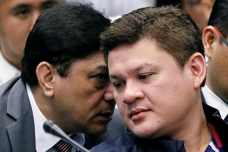 Mr Paolo Duterte (right) listening to his lawyer at the hearing yesterday on a $168.5 million drug shipment.