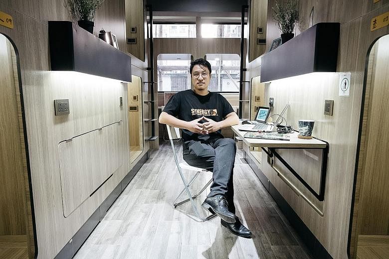 Synergy Biz Group co-founder Keith Wong inside a room at the company's Bibliotheque co-living development in Yau Ma Tei. A single room of about 400 sq ft in the development may sleep as many as 10 people.