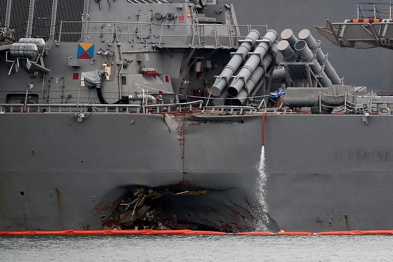 The damaged USS John McCain docked at Changi Naval Base in Singapore on Aug 22. The Government Accountability Office, along with military leaders and lawmakers, have long highlighted their worries about the navy's readiness as duration of deployments