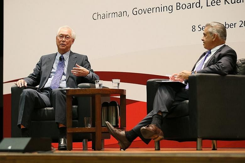 ESM Goh Chok Tong and Lee Kuan Yew School of Public Policy dean Kishore Mahbubani at a dialogue to mark the school's 13th anniversary yesterday. Mr Goh shared personal experiences, like how the 2003 Sars crisis was the most frightening challenge he f