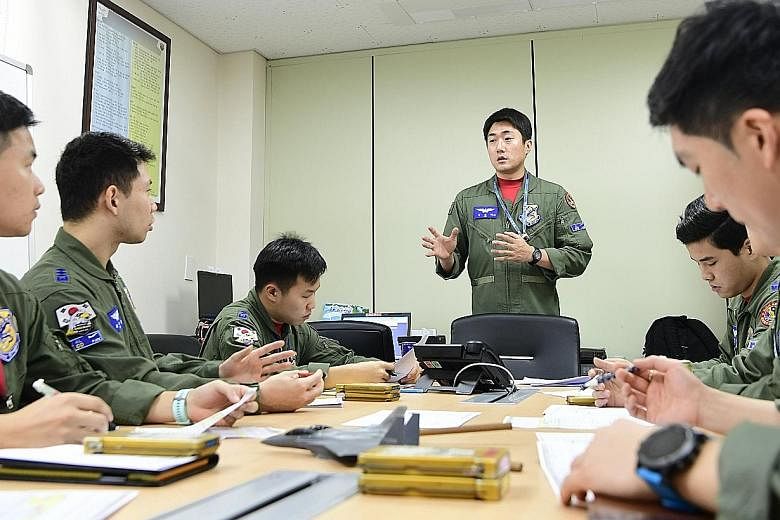 South Korean fighter pilots being briefed before their exercise in Cheongju.