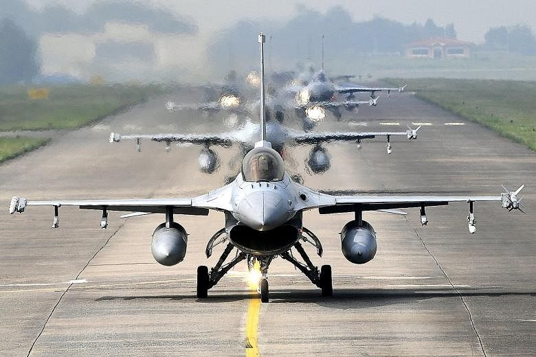 A South Korean Defence Ministry's handout photo shows KF-16 fighters taxiing at an air base in the city of Cheongju, central South Korea, on Thursday. The Republic of Korea Air Force has been conducting a week-long air combat exercise to practise rea
